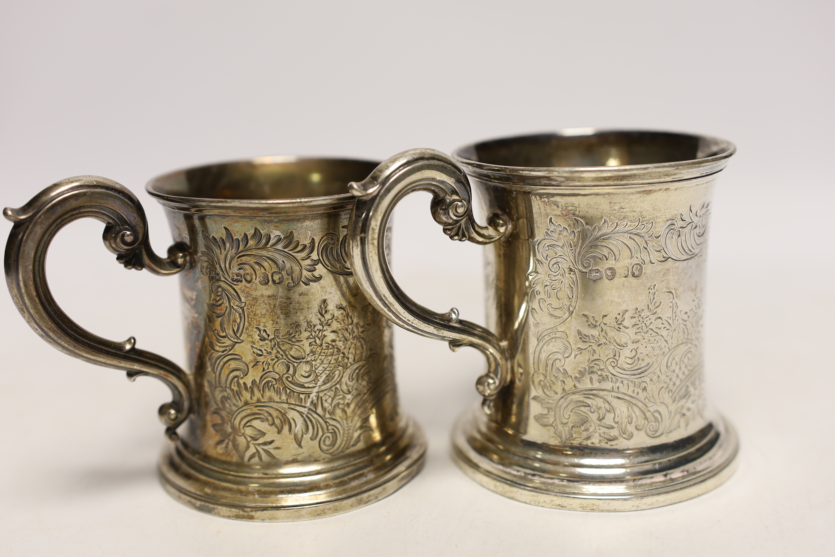 Two Victorian engraved silver christening mugs, the smallest by The Barnards, London, 1845, 86mm, 9.8oz.